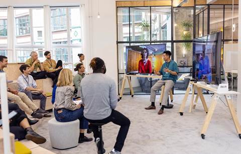 Healthcare professionals gathered in a modern conference room to learn about 1099 compliance