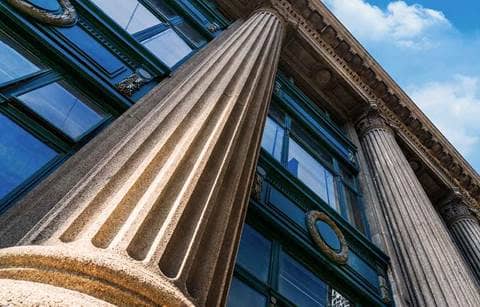 A photo of pillars of a government building. 