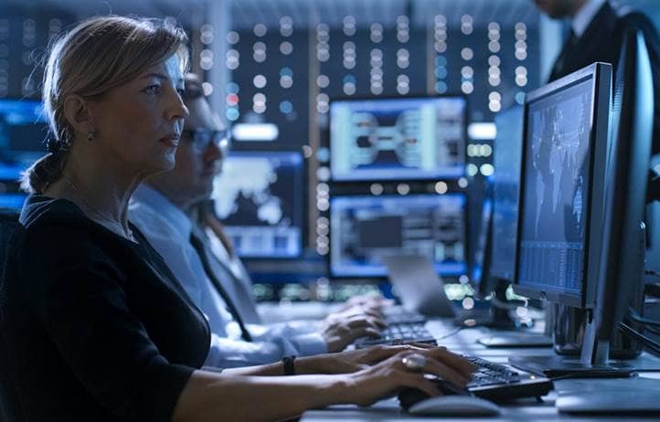 Cybersecurity professional working on their computer.