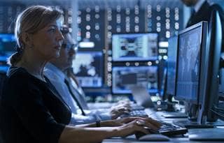 Cybersecurity professional working on their computer.